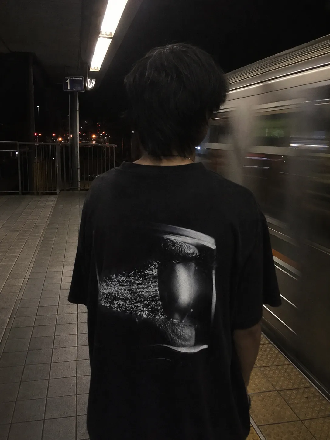 The STATIC tee worn, the print large across the back.