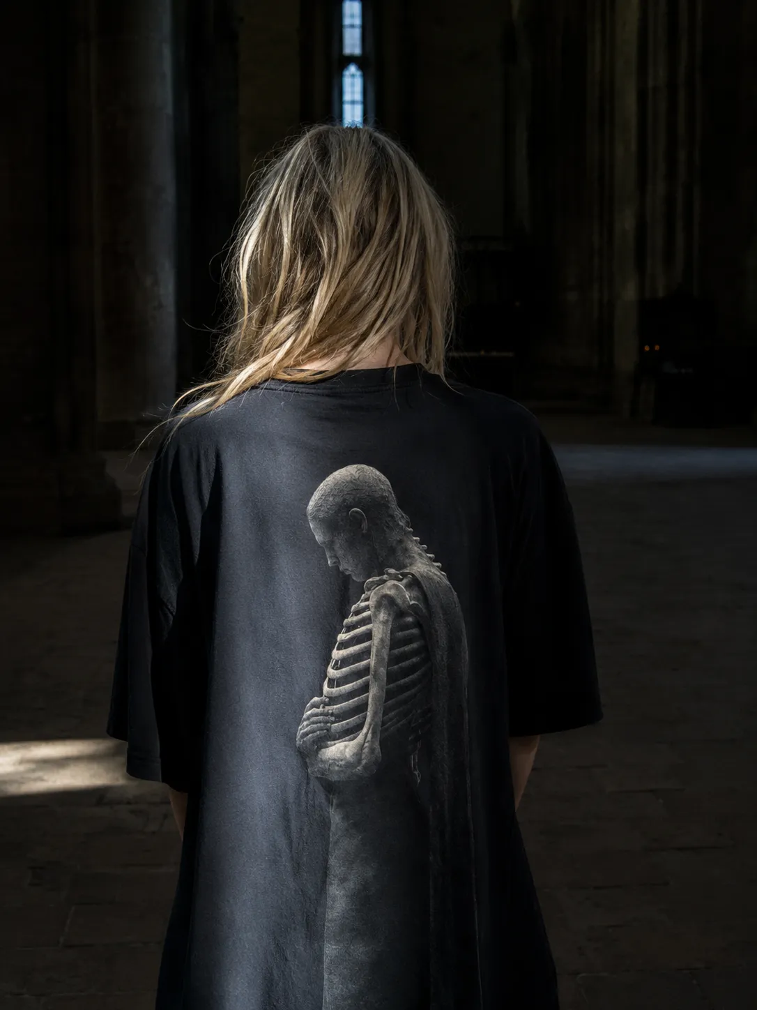 The HOLLOW tee worn, seen from behind.