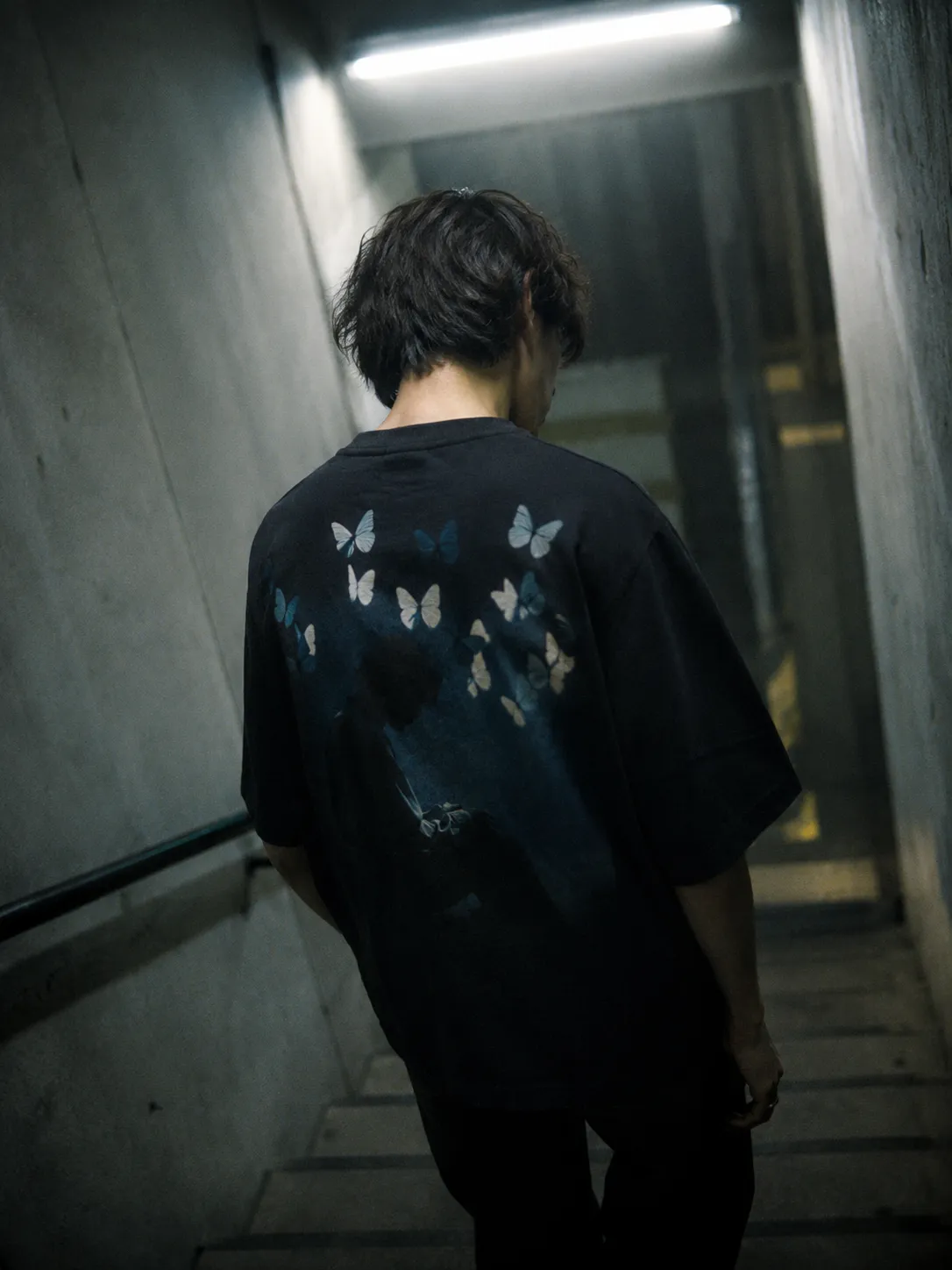 The SILENCE tee worn, the print large across the back.